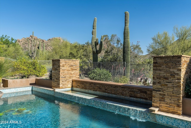 view of pool featuring pool water feature