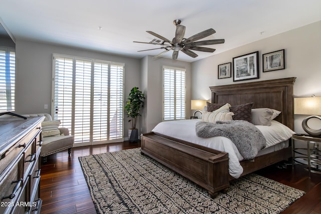 bedroom featuring multiple windows, ceiling fan, and dark wood-type flooring