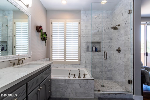 bathroom with plus walk in shower and vanity