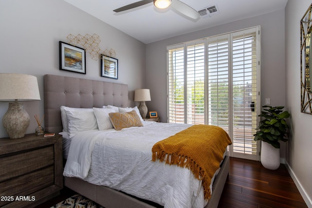 bedroom featuring dark hardwood / wood-style flooring and ceiling fan