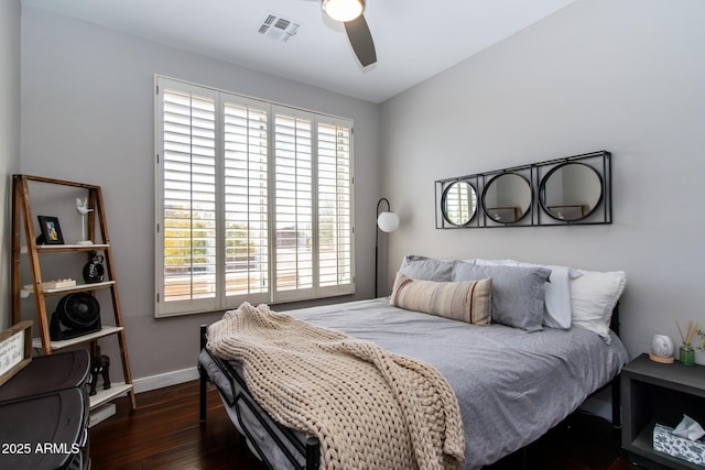 bedroom featuring ceiling fan and dark wood-type flooring