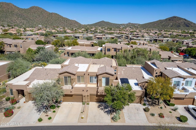 birds eye view of property with a mountain view