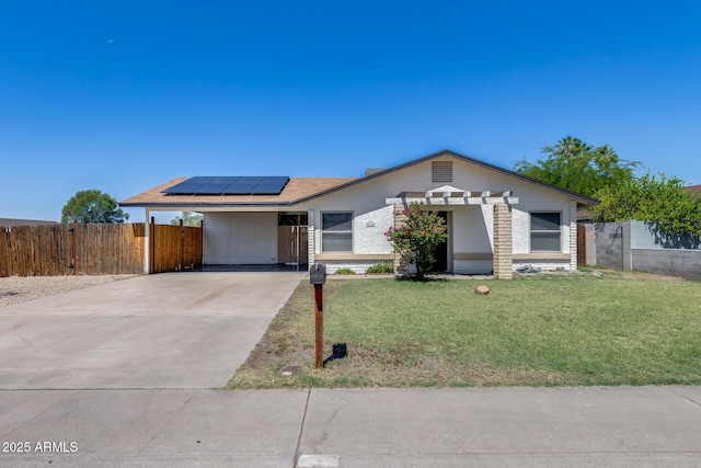 5504 N 69th Ave, Glendale, AZ 85303 - view of front of property featuring solar panels, concrete driveway, and a carport