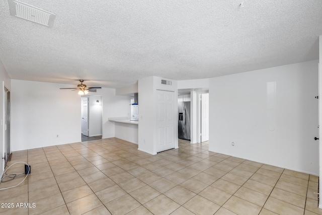 5504 N 69th Ave, Glendale, AZ 85303 - unfurnished living room featuring a textured ceiling and a ceiling fan