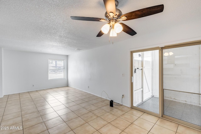 5504 N 69th Ave, Glendale, AZ 85303 - spare room with a ceiling fan, a textured ceiling, and light tile patterned floors