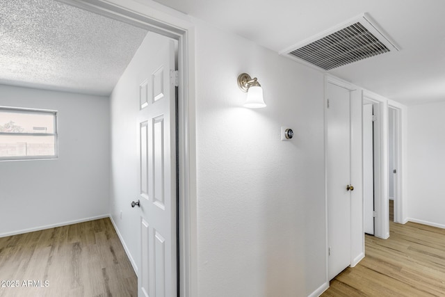 5504 N 69th Ave, Glendale, AZ 85303 - hallway featuring light wood finished floors and baseboards