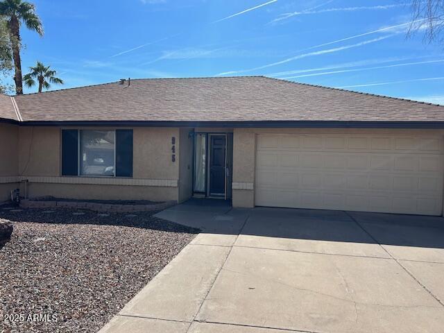 945 W Mendoza Ave, Mesa, AZ 85210 - ranch-style house featuring stucco siding, concrete driveway, roof with shingles, and a garage