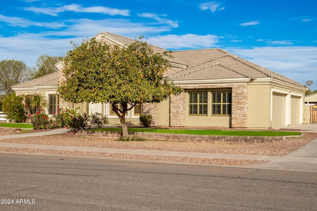 view of front of property with a garage