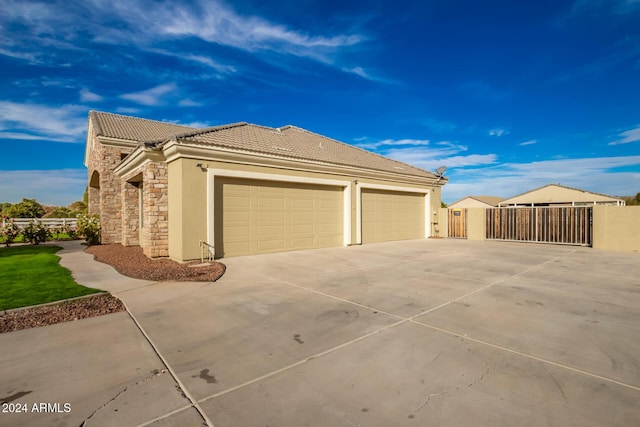 view of side of property featuring a garage