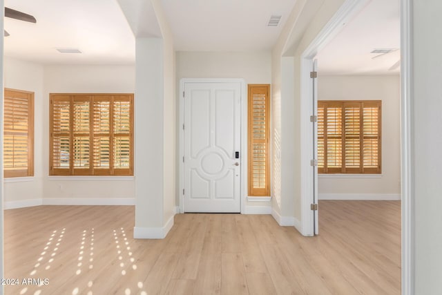 entryway with light hardwood / wood-style floors