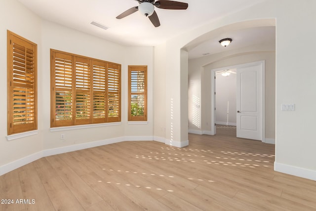 unfurnished room featuring ceiling fan and light wood-type flooring