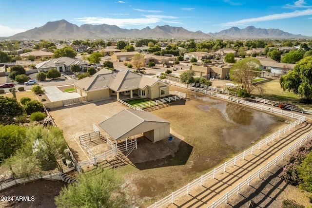 birds eye view of property with a mountain view