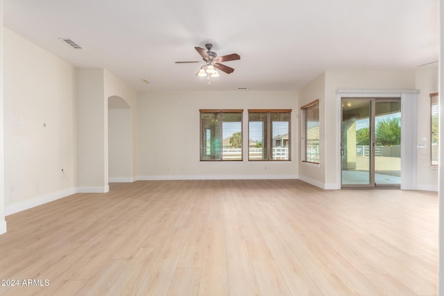 spare room featuring ceiling fan and light wood-type flooring