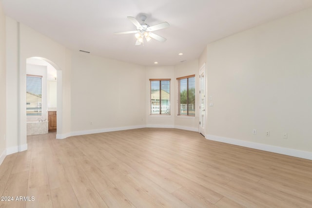 spare room with light hardwood / wood-style floors and ceiling fan