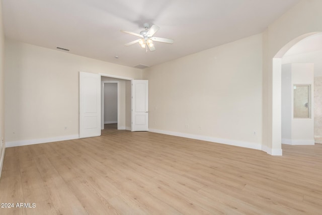 spare room with light hardwood / wood-style flooring and ceiling fan