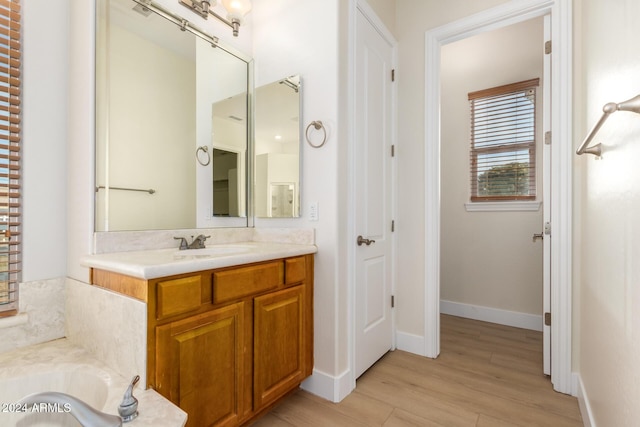 bathroom featuring hardwood / wood-style floors and vanity