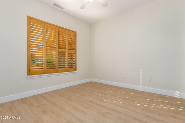 spare room with light hardwood / wood-style flooring and ceiling fan