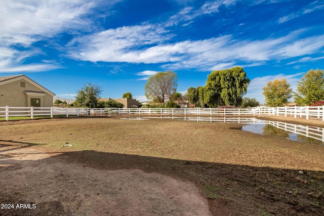 view of yard with a rural view