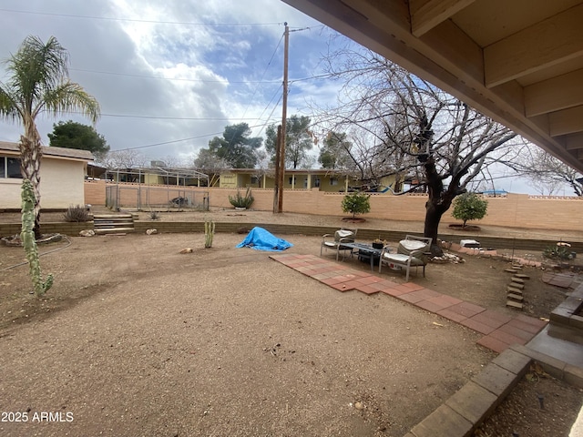 view of patio / terrace featuring fence