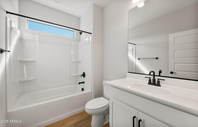 full bath featuring shower / washtub combination, vanity, toilet, and wood finished floors