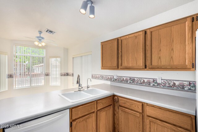 3349 E Lavey Ln, Phoenix, AZ 85032 - kitchen with ceiling fan, visible vents, light countertops, a sink, and white dishwasher