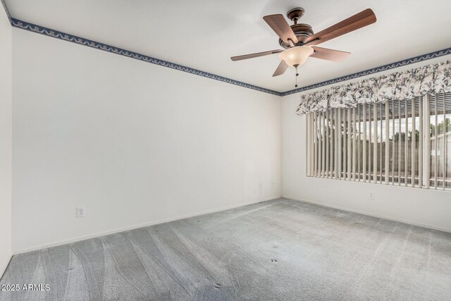 3349 E Lavey Ln, Phoenix, AZ 85032 - empty room with carpet floors, baseboards, and a ceiling fan