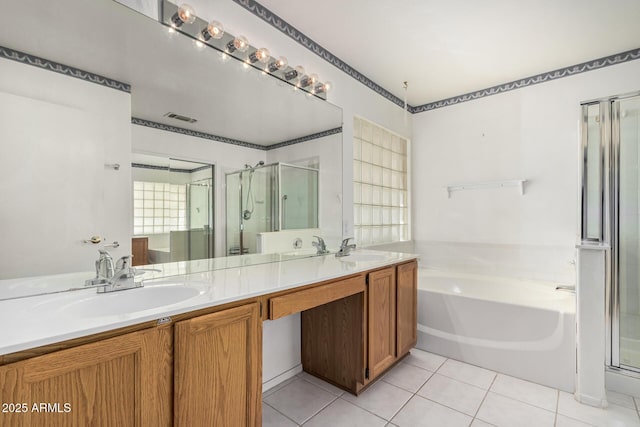 3349 E Lavey Ln, Phoenix, AZ 85032 - bathroom with a sink, double vanity, a stall shower, visible vents, and a garden tub