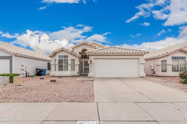 3349 E Lavey Ln, Phoenix, AZ 85032 - view of front facade featuring a tile roof, an attached garage, driveway, and stucco siding