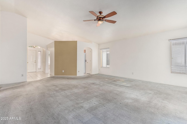 3349 E Lavey Ln, Phoenix, AZ 85032 - carpeted empty room featuring arched walkways, ceiling fan, and vaulted ceiling