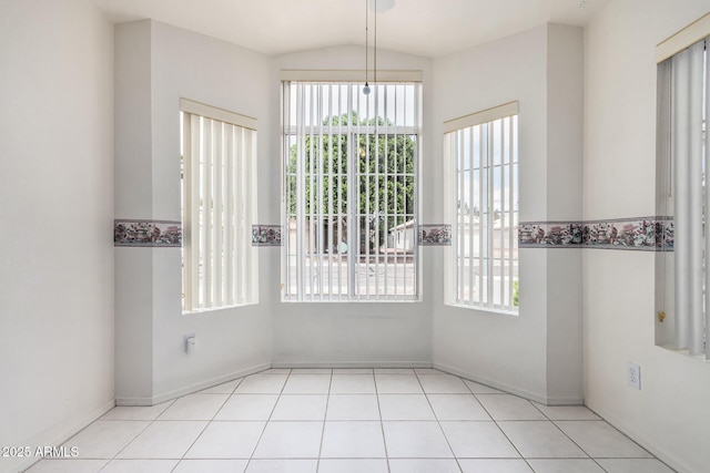 3349 E Lavey Ln, Phoenix, AZ 85032 - unfurnished dining area with a wealth of natural light, vaulted ceiling, and baseboards