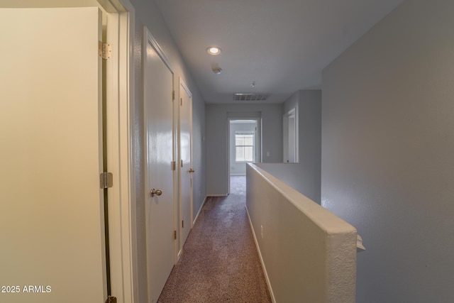 hallway with carpet flooring