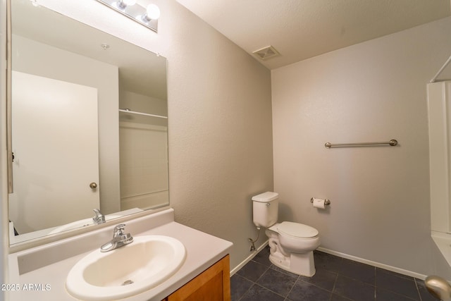 full bathroom with washtub / shower combination, vanity, toilet, and tile patterned flooring