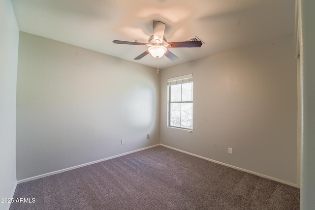 spare room featuring carpet floors and ceiling fan