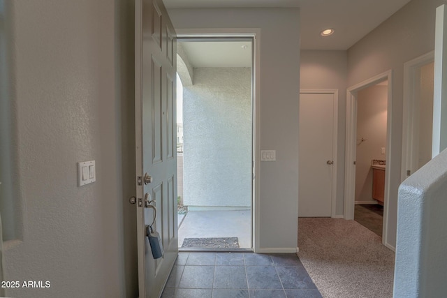 corridor with light tile patterned floors