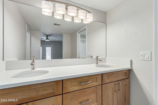 bathroom featuring vanity and ceiling fan