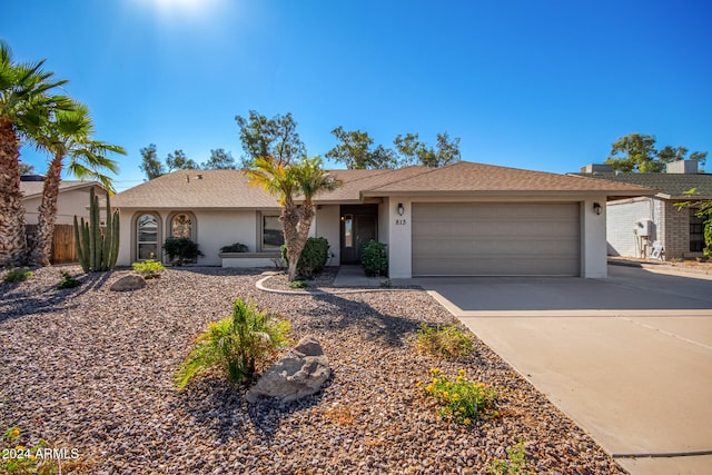 ranch-style house featuring a garage