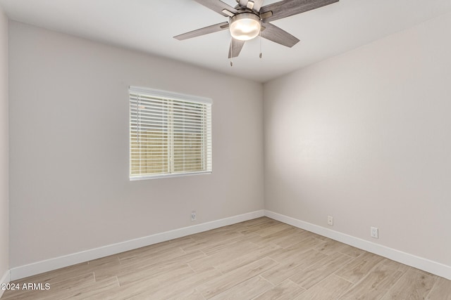 spare room with light hardwood / wood-style floors and ceiling fan