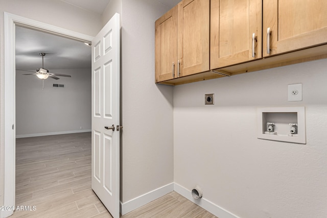 clothes washing area featuring cabinets, ceiling fan, hookup for an electric dryer, hookup for a washing machine, and light wood-type flooring