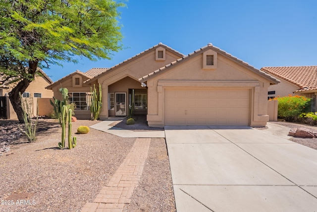 4037 E Milton Dr, Cave Creek, AZ 85331 - view of front of property with concrete driveway, an attached garage, stucco siding, and a tiled roof