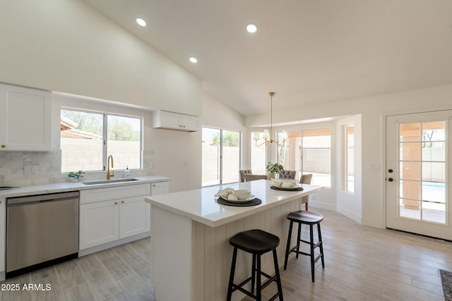 4037 E Milton Dr, Cave Creek, AZ 85331 - kitchen featuring dishwasher, vaulted ceiling, a kitchen breakfast bar, a chandelier, and recessed lighting