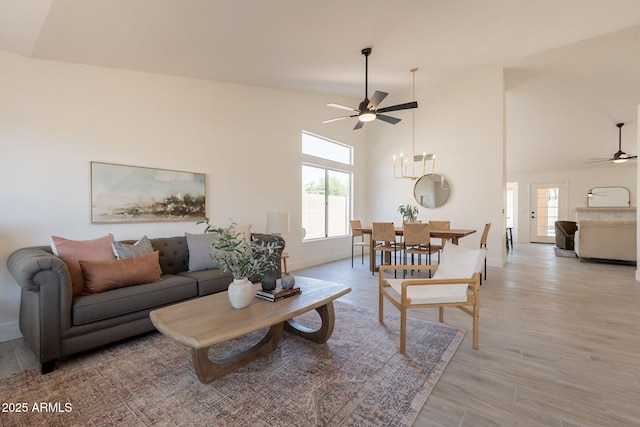 4037 E Milton Dr, Cave Creek, AZ 85331 - living area featuring ceiling fan, light wood finished floors, and a towering ceiling