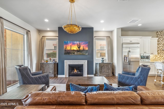 625 W Echo Ln, Phoenix, AZ 85021 - living room featuring recessed lighting, visible vents, wood finished floors, and a glass covered fireplace