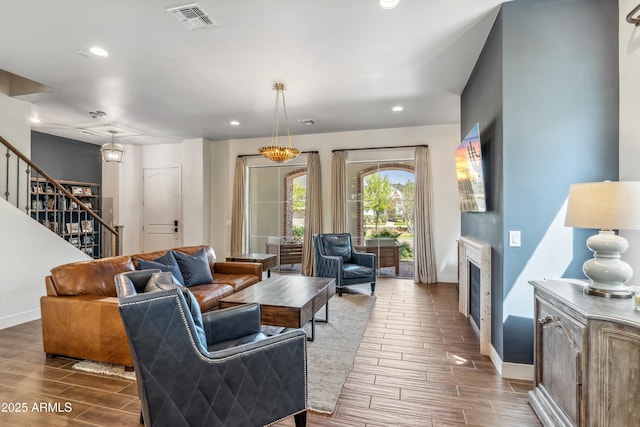 625 W Echo Ln, Phoenix, AZ 85021 - living room with recessed lighting, stairs, baseboards, visible vents, and wood finish floors
