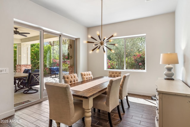625 W Echo Ln, Phoenix, AZ 85021 - dining room with a healthy amount of sunlight, wood finish floors, ceiling fan with notable chandelier, and baseboards