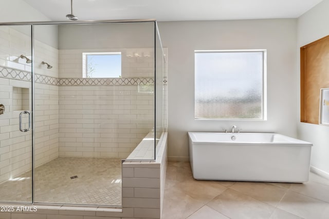 625 W Echo Ln, Phoenix, AZ 85021 - bathroom with tile patterned floors, baseboards, a stall shower, and a soaking tub