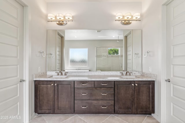 625 W Echo Ln, Phoenix, AZ 85021 - full bath with a tile shower, double vanity, a sink, and tile patterned floors