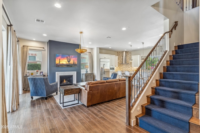 625 W Echo Ln, Phoenix, AZ 85021 - living area featuring stairway, visible vents, recessed lighting, and a warm lit fireplace