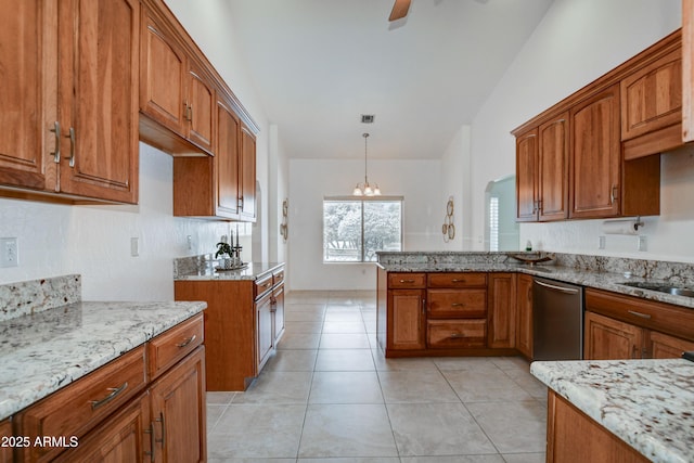 kitchen with light tile patterned flooring, dishwasher, pendant lighting, light stone countertops, and ceiling fan with notable chandelier