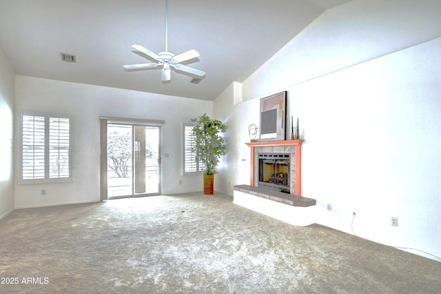 unfurnished living room featuring carpet floors, high vaulted ceiling, and ceiling fan