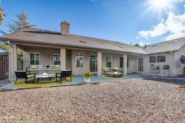 back of property featuring a patio area